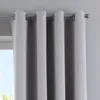 A close-up view of gray curtains hanging from a rod. Produktbild-Vorschau