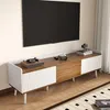 A modern TV stand with a wooden top and white fluted cabinet doors, featuring a turntable and camera on top. Náhled obrázku produktu