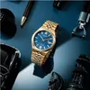 A gold Citizen watch with a blue face is displayed on a blue surface, surrounded by other luxury items like a pen, a car model, and chess pieces. Podgląd zdjęcia produktu