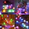 A collage of four images showing colorful LED string lights in various decorative settings. Produktbild-Vorschau