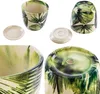 A collage of images showing a ceramic pot with a leaf pattern, including close-ups of the interior and base, and its saucer. Voir les images du produit