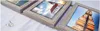 A set of three framed pictures arranged diagonally on a white surface. Produktbild-Vorschau