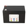 A black battery with a label showing production date information and safety symbols. Produktbild-Vorschau
