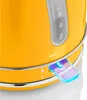 A close-up shot of the base of a yellow electric kettle, focusing on the water level indicator and the power switch. Produktbild-Vorschau