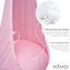 A close-up view of a pink hanging chair with text overlays describing its filling. Produktbild-Vorschau