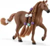 A brown toy horse with braided mane and tail, decorated with colorful beads. Voir les images du produit