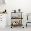 A black metal shelving unit with three shelves, filled with kitchen items like bread, bananas, and jars, is placed in a kitchen setting next to a white stool. Náhled obrázku produktu