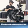 A man is loading a folding electric bike into the trunk of a car. Produktbild-Vorschau