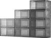 A stack of transparent gray shoe storage boxes arranged in a staircase pattern against a white background. Podgląd zdjęcia produktu