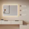 A modern bathroom vanity with a lighted mirror above it. Anteprima dell’immagine prodotto