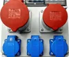 A close-up view of an electrical distribution box with multiple outlets. Produktbild-Vorschau