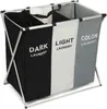 A three-compartment laundry basket with labels for dark, light, and color laundry. Produktbild-Vorschau