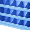 A close-up view of a blue storage shelf with multiple compartments. Produktbild-Vorschau