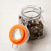 A close-up shot of a glass jar filled with peppercorns, with the lid open. Anteprima dell’immagine prodotto