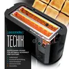 A cutaway view of a black toaster with glowing heating elements, highlighting its internal components and features. Náhľad obrázku produktu
