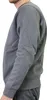 A person wearing a dark grey Nike pullover, shown from the side. Produktbild-Vorschau