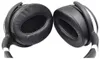 A close-up, studio shot of a pair of black over-ear headphones, viewed from the front. Voir les images du produit
