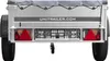 Rear view of a trailer with a cover and license plate. Podgląd zdjęcia produktu