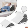 A collage of images showing an orthopedic wedge pillow in use and its dimensions. Anteprima dell’immagine prodotto