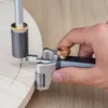 A hand is using a woodworking scribing tool to draw a line on a piece of wood. Produktbild-Vorschau
