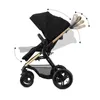 A black and gold Kinderkraft MOOV 2 XL 3in1 Kombikinderwagen is shown from the side against a white background. Arrows indicate adjustable features. Náhled obrázku produktu