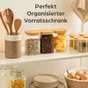 A kitchen shelf displaying various food storage containers and kitchen utensils. Produktbild-Vorschau