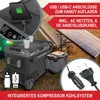 A portable cooler box is set up outdoors with a solar panel and camping tent in the background. Produktbild-Vorschau