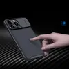 A hand is shown touching a phone case with a camera cover. Náhľad obrázku produktu