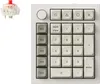 A mechanical keyboard numpad and a keyboard switch are shown against a white background. Produktbild-Vorschau