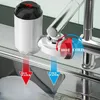 A close-up view of a kitchen faucet with a water heater attachment, showing hot and cold water flow. Produktbild-Vorschau