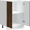 A white cabinet with two doors, one of which is open, revealing two shelves inside. One door has a dark wood grain finish. Náhľad obrázku produktu