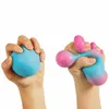 Two hands are shown squeezing stress balls against a white background. Voir les images du produit