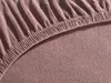 A close-up view of a brown jersey fitted sheet, showing the elasticized edge and the textured fabric. Produktbild-Vorschau