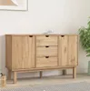 A wooden sideboard with drawers and cabinets is displayed in a room with a plant and a picture on the wall. Podgląd zdjęcia produktu