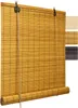 A close-up view of a rolled-up bamboo blind, with swatches of different colors of the same blind visible on the right side. Voir les images du produit