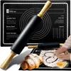 A baking mat with a rolling pin and a croissant. Voir les images du produit