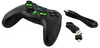 A black and green wireless gamepad with its USB receiver and charging cable, presented on a white background. Podgląd zdjęcia produktu