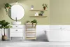 A modern bathroom with a bathtub, sink, vanity, and shelves, decorated with plants. Anteprima dell’immagine prodotto