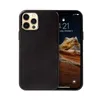 A black leather iPhone 12 Pro Max case is shown next to the phone it protects. Anteprima dell’immagine prodotto