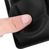 A finger presses down on a black silicone ice cube mold. Náhled obrázku produktu