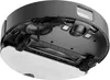 The underside of a black robot vacuum cleaner is shown on a white background. Náhled obrázku produktu