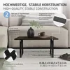 A close-up of a table with black metal legs, a dark wood top, and decorative elements like a vase and a mug. The image includes informational callouts about the product's construction and dimensions. Náhľad obrázku produktu