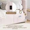 A close-up view of a pink upholstered bed frame, highlighting its integrated USB charging ports and a pocket for storing a phone. Anteprima dell’immagine prodotto