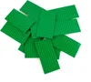 A pile of green LEGO baseplates on a white background. Produktbild-Vorschau