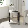 A small side table with marble-look top and shelves, placed next to a sofa in a living room setting. Produktbild-Vorschau