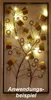 A decorative wall hanging with LED lights, possibly a lamp or a light fixture, displayed on a textured wall. Produktbild-Vorschau