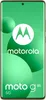 A Motorola smartphone with a green background and abstract green circles. Produktbild-Vorschau