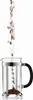 Coffee beans being poured into a French press coffee maker. Produktbild-Vorschau
