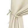 A close-up view of a beige curtain tie-back. Anteprima dell’immagine prodotto