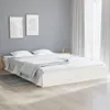 A white bed frame with white bedding in a room with gray walls and white curtains. Produktbild-Vorschau